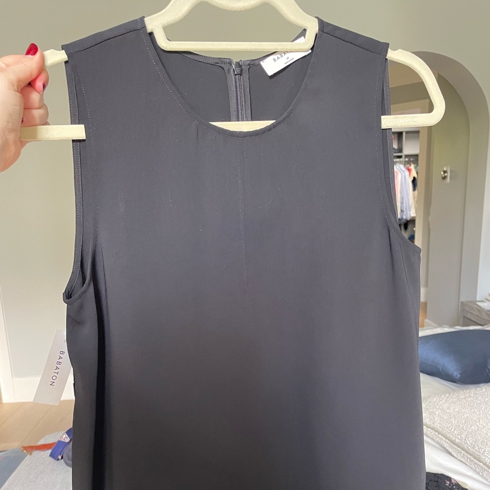 Brand new black silk type top.